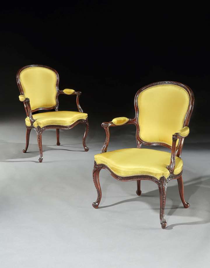 A PAIR OF GEORGE III MAHOGANY OPEN ARMCHAIRS